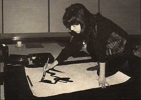 Master Takase during a calligraphy demonstration